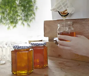 Someone collecting honey